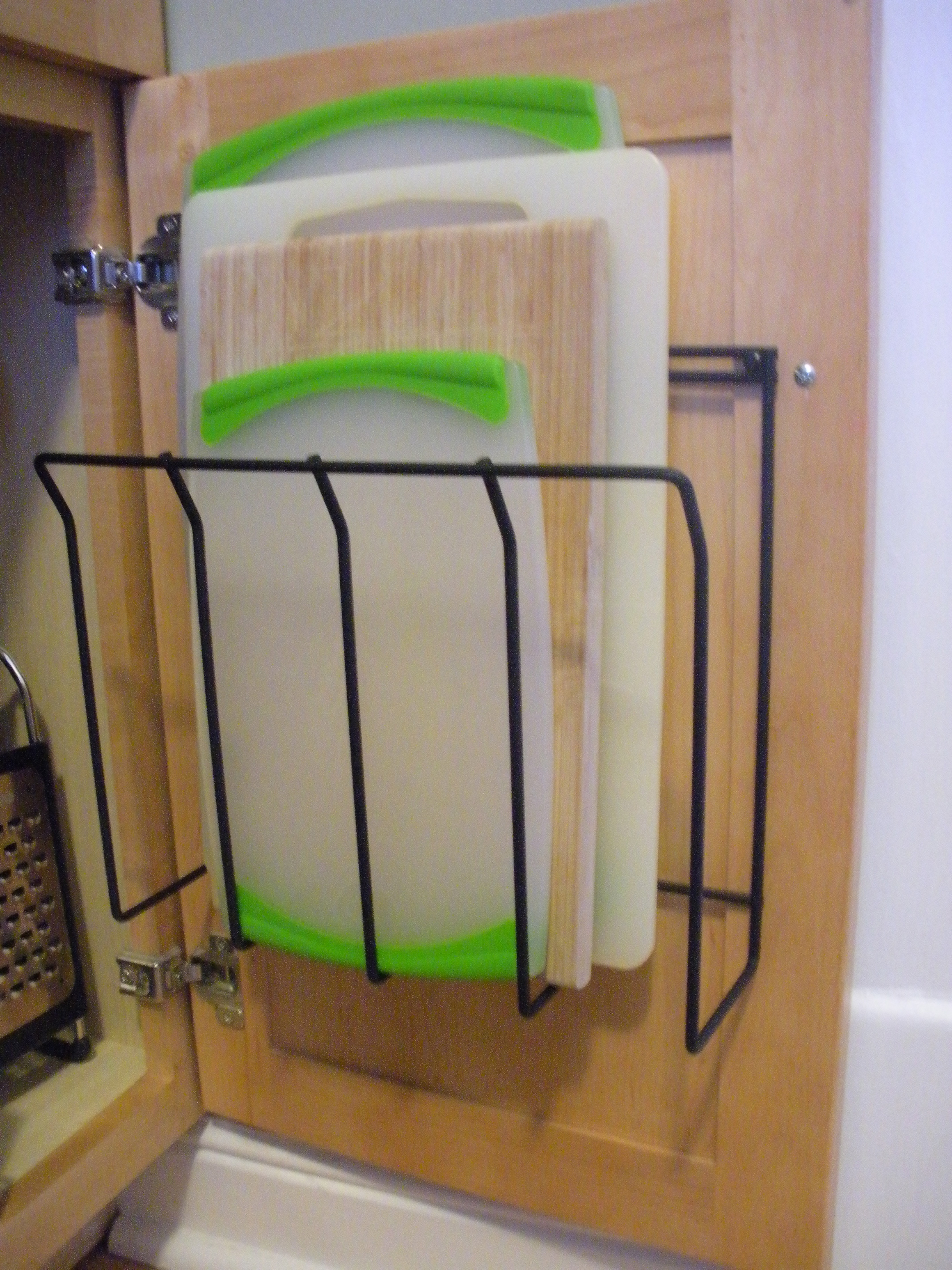 Simple Idea: Magazine Holder = In Cabinet Cutting Board Organization – The  Simple Elements